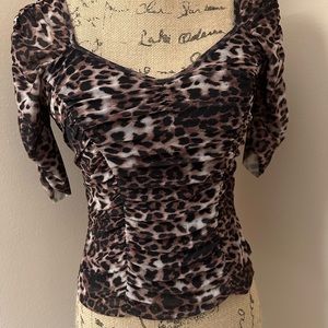 New without tags animal print short sleeve top.